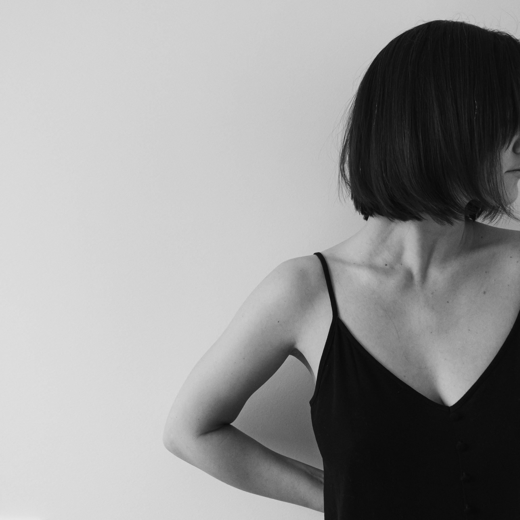 Woman Wearing a Black Dress on White Background