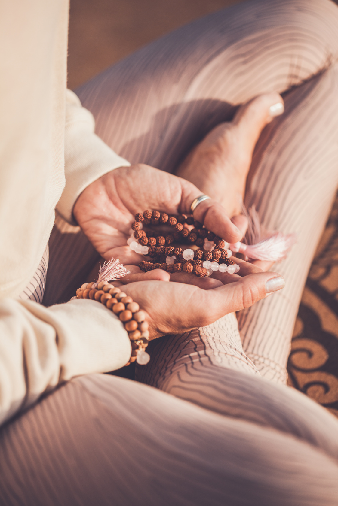 woman with mala beads meditating